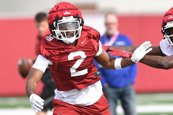 Arkansas defensive back Dwight McGlothern (2) releases from a receiver Thursday, March 30, 2023, during practice at the university practice facility in Fayetteville.
