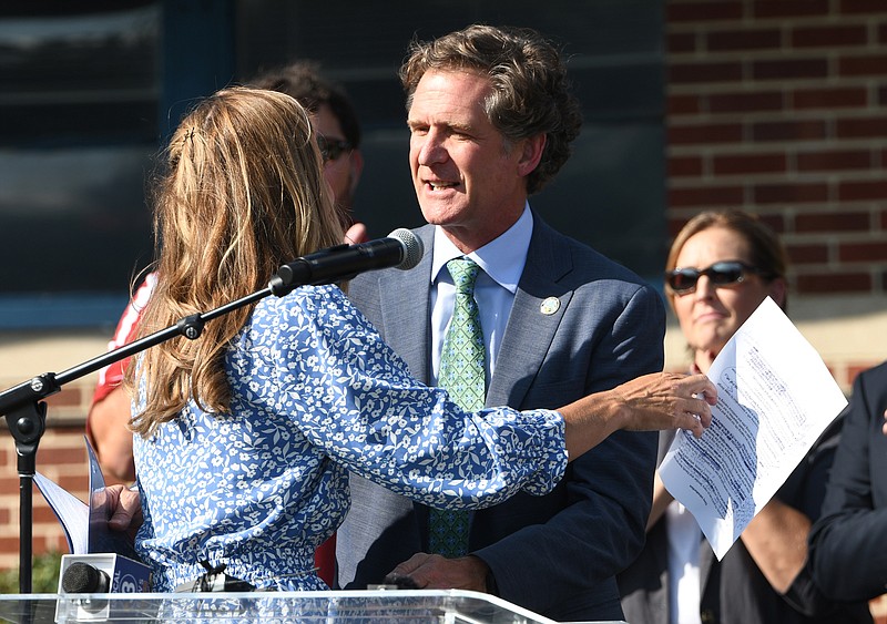 Staff Photo by Robin Rudd / Chattanooga Mayor Tim Kelly hugs his wife Ginny, before announcing that he will run for a second term.  The campaign announcement was made at The Youth and Family Development Center at 501 W. 12th Street on September 7, 2023.