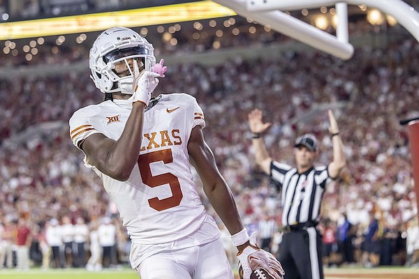 Texas wide receiver Adonai Mitchell (5) gestures to the crowd after a touchdown against Alabama during the second half of an NCAA college football game Saturday, Sept. 9, 2023, in Tuscaloosa, Ala. (AP Photo/Vasha Hunt)