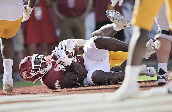 Arkansas running back Rashod Dubinion scores a touchdown during a game against Kent State on Saturday, Sept. 9, 2023, in Fayetteville.