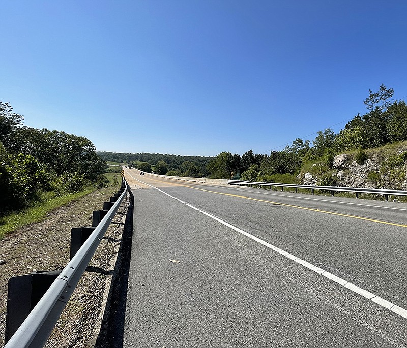 This two-lane bridge over White River is part of the U.S. 412 corridor that stretches from Siloam Springs to Paragould. Such a large segment of the highway, about 200 miles, is mostly two or three lanes wide. State officials want to see it become a four-lane highway from end to end. (Arkansas Democrat-Gazette/Tony Holt)
