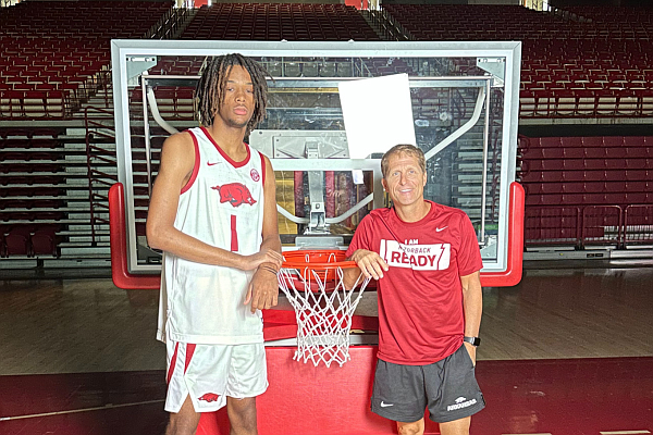 Four-star forward Jalen Shelley is shown with Arkansas coach Eric Musselman during his official visit.