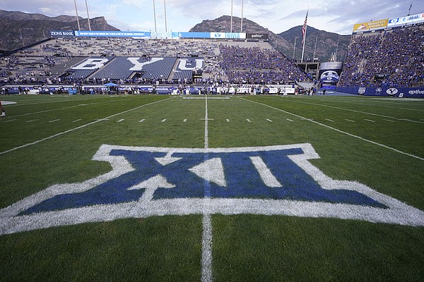 The logo for the Big 12 Conference has been applied to the field for an NCAA college football game between Sam Houston State and BYU on Saturday, Sept. 2, 2023, in Provo, Utah. (AP Photo/Rick Bowmer)