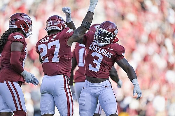 Arkansas linebackers Antonio Grier (3) and Chris Paul (27) celebrate during a game against Kent State on Saturday, Sept. 9, 2023, in Fayetteville.