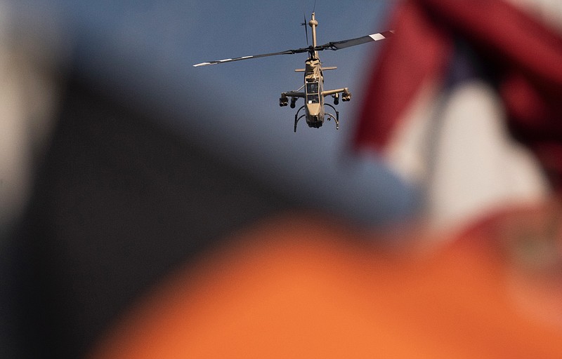 Photo by the Mrs. 5-at-10 / A Cobra helicopter flies over Monday's parade in downtown Chattanooga. The Cobra was the same model used by Capt. Larry Taylor when he saved four soldiers during the Vietnam War. Taylor, who got the Congressional Medal of Honor last week, was honored at the 9/11 parade. Mrs. 5-at-10 has mad talent; the 5-at-10 knows a lot of movie quotes. So there's that.