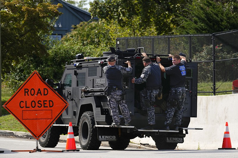 Law enforcement officers ride by a roadblock as the search for escaped convict Danelo Cavalcante continues in Pottstown, Pa., Tuesday, Sept. 12, 2023. (AP/Matt Rourke)