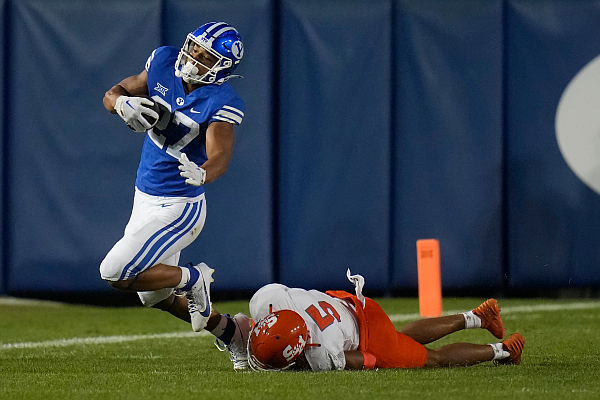 Sam Houston State defensive back David Fisher (5) tackles BYU running back LJ Martin (27) during the second half of an NCAA college football game Saturday, Sept. 2, 2023, in Provo, Utah. (AP Photo/Rick Bowmer)