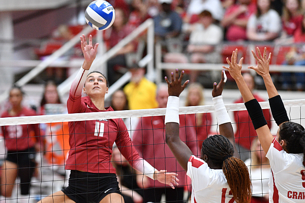 Arkansas’ Maggie Cartwright (11) tips the ball over the net Wednesday, Aug. 20, 2023, as Wisconsin’s Temi Thomas-Ailara (12) reaches to defend during play in Barnhill Arena in Fayetteville. Arkansas’ Maggie Cartwright (11) tips the ball over the net Wednesday, Aug. 20, 2023, as Wisconsin’s Temi Thomas-Ailara (12) reaches to defend during play in Barnhill Arena in Fayetteville.