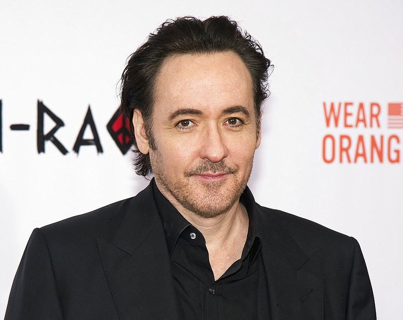 FILE - In this Dec. 1, 2015 file photo, actor John Cusack attends the premiere of "Chi-Raq" in New York. The Tribeca Film The Tribeca Film Festival announced Thursday that writer-director Cameron Crowe and the cast of "Say Anything..." led by John Cusack will celebrate the 30th anniversary of the classic romance. The 18th Tribeca Film Festival runs April 25-May 5. (Photo by Charles Sykes/Invision/AP, File)