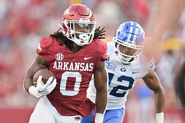 Arkansas running back AJ Green (0) runs the ball for score, Saturday, September 16, 2023 during the first quarter of a football game at Donald W. Reynolds Razorback Stadium in Fayetteville. Visit nwaonline.com/photos for the photo gallery.
