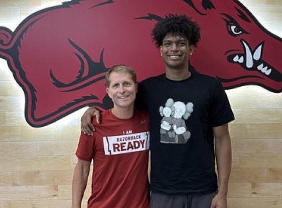 Arkansas coach Eric Musselman and 4-star prospect Isaiah Elohim during his official visit to Fayetteville.