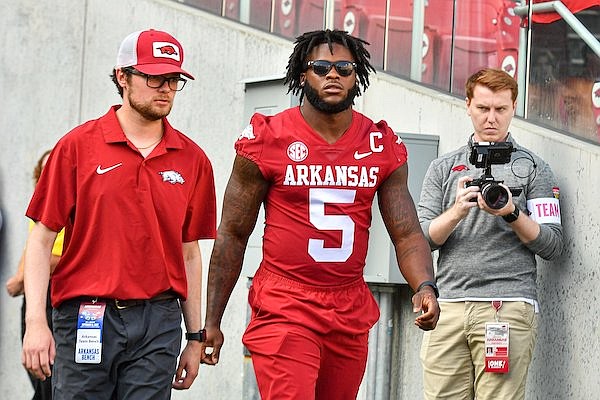 Arkansas running back Raheim Sanders (5) walks onto the field prior to the Razorbacks' game against BYU on Saturday, Sept. 16, 2023, in Fayetteville. Sanders missed his second consecutive game with a knee injury.