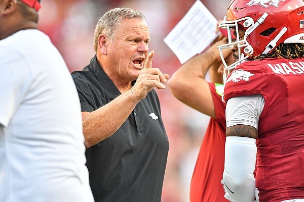 Arkansas head coach Sam Pittman visits with tight end Ty Washington (8) on the sideline, Saturday, Sept, 16, 2023, during the first quarter of the BYU Cougars’ 38-31 win over the Razorbacks at Donald W. Reynolds Razorback Stadium in Fayetteville. Visit nwaonline.com/photo for the photo gallery.