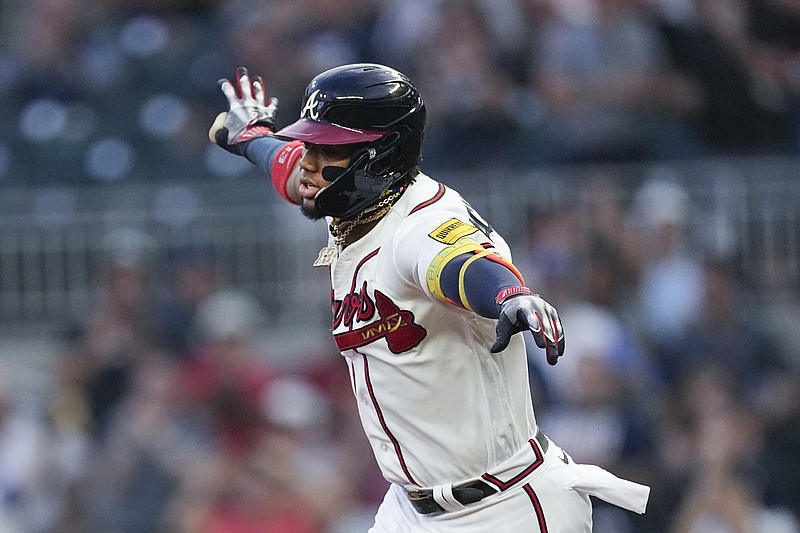 Atlanta Braves' Ronald Acuna Jr. celebrates as he runs the bases after hitting a home run in the first inning of a baseball game against the Philadelphia Phillies Tuesday, Sept. 19, 2023. (AP Photo/John Bazemore)