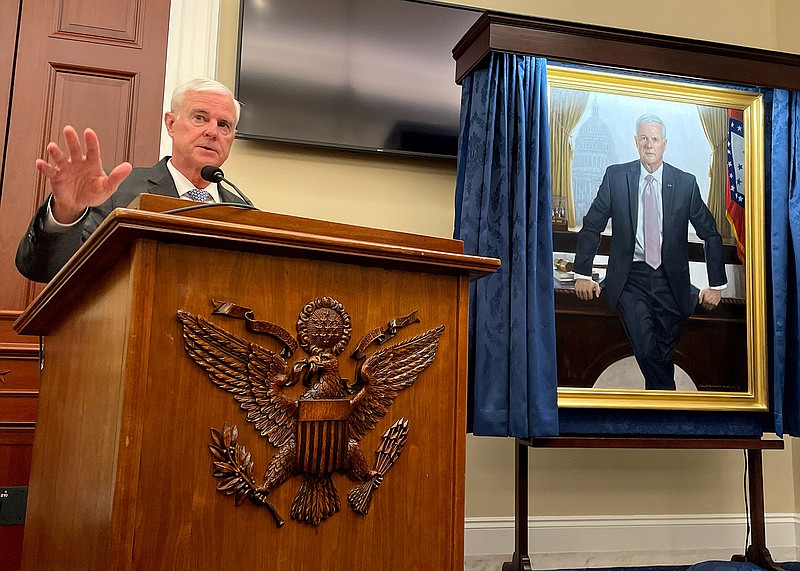 Rep. Steve Womack, R-Ark., speaking Tuesday Sept. 19, 2023 in front of a portrait recognizing his time as House Budget Committee chairman. (Arkansas Democrat-Gazette/Alex Thomas)