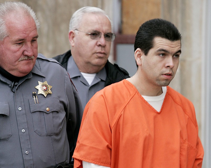 FILE - Anthony Sanchez, right, is escorted into a Cleveland County courtroom for a preliminary hearing, Feb. 23, 2005, in Norman, Okla. On Thursday, Sept. 21, 2023, Oklahoma plans to execute Sanchez for the 1996 slaying of a University of Oklahoma dance student in a case that went unsolved for years. Sanchez, 44, is scheduled to receive a lethal injection at 10 a.m. at the Oklahoma State Penitentiary in McAlester, Okla. (Jaconna Aguirre/The Oklahoman via AP, File)