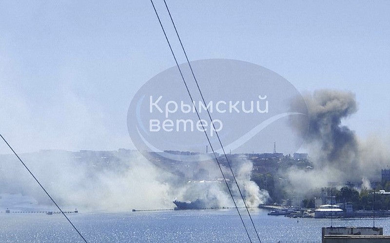 This image taken from UGC video shows smoke rising from the headquarters of Russia’s Black Sea Fleet in Sevastopol, Crimea, Friday Sept. 22, 2023. Ukraine carried out a fiery missile strike Friday on the main headquarters of Russia’s Black Sea Fleet and one serviceman was missing, the Russian Defense Ministry said (Crimean Telegram channel via AP)