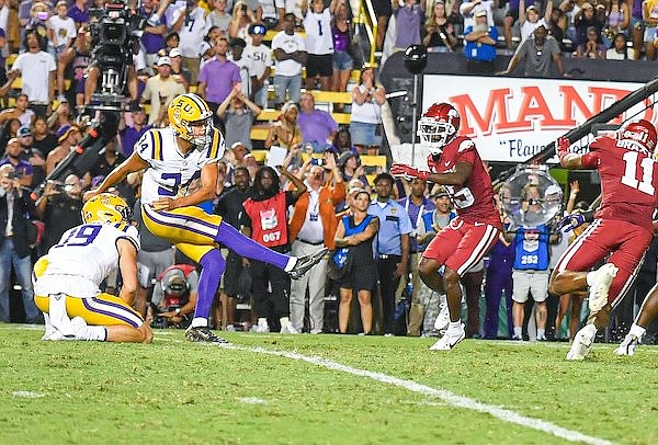 LSU kicker Damian Ramos (34) kicks the game-winning field goal with 5 seconds remaining in the Tigers' 34-31 victory over Arkansas on Saturday, Sept. 23, 2023, in Baton Rouge, La.