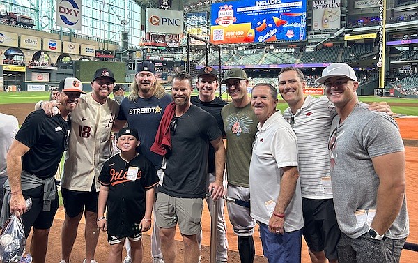 From left to right: Arkansas director of baseball operations Clay Goodwin, director of video and scouting Zach Barr, Gage Goodwin, Houston Astros pitcher Ryne Stanek, Arkansas pitching coach Matt Hobbs, Baltimore Orioles outfielder Heston Kjerstad and catcher James McCann, Arkansas head coach Dave Van Horn and Arkansas assistant coaches Bobby Wernes and Nate Thompson are shown in Houston on Monday, Sept. 18, 2023. (Photo courtesy Arkansas Athletics)