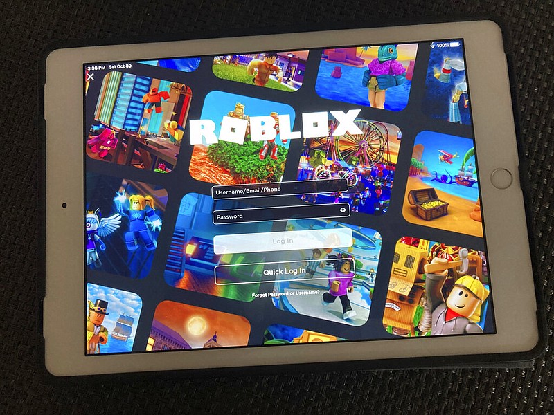 The gaming platform Roblox is displayed on a tablet in New York in this Oct. 30, 2021 file photo. Bentonville-based retailer Walmart Inc. on Tuesday, Sept. 26, 2023 announced that Walmart Discovered, its new "experience" on Roblox, lets users vote for their favorite games, "indie" experiences and virtual items. (AP/Leon Keith)