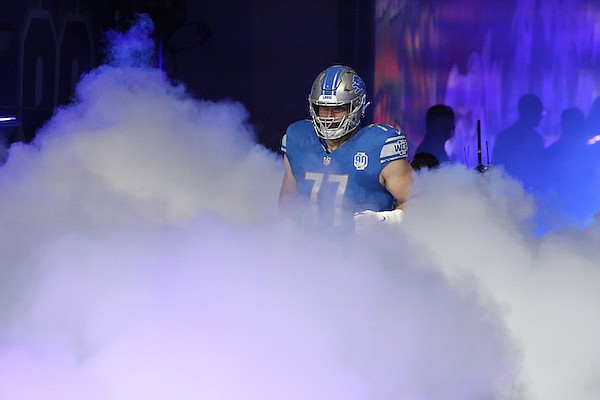 Detroit Lions center Frank Ragnow (77) is introduced before an NFL football game against the Seattle Seahawks Sunday, Sept. 17, 2023, in Detroit. (AP Photo/Duane Burleson)
