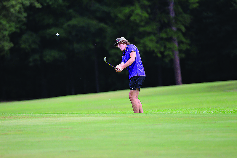 El Dorado's Cooper Henry chips a shot during a tournament earlier this season. The Wildcats will compete in the 5A Boys State Golf Tournament Monday in Alma.