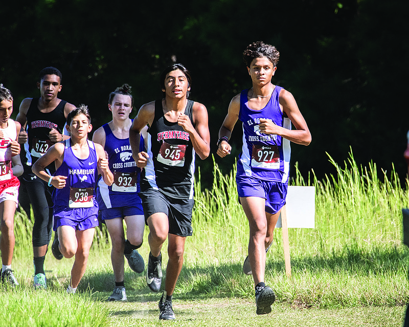 El Dorado's Julian Marquez leads Hermitage's Eric Hernandez in the early stages of the junior boys  race Saturday at the Wildcat Invitational. Marquez won the race and led El Dorado to the team title. El Dorado won both senior high and junior high boys' events.