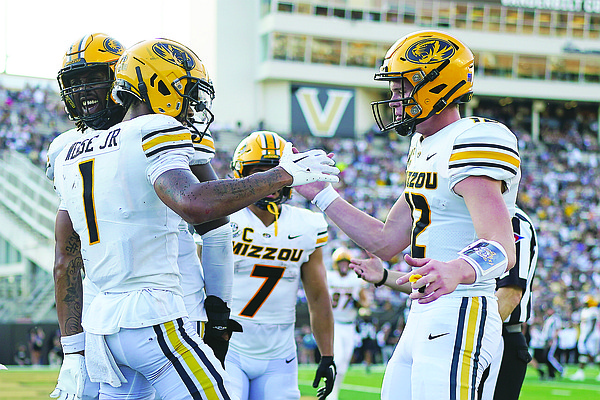Cook throws for careerhigh 395 yards as Missouri beats Vandy
