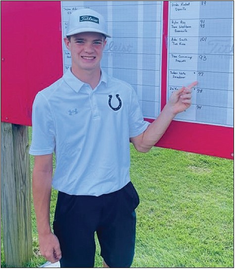Contributed Photo

Wolfe earns All-State: Smackover’s Judson Wolfe points to his score of 77 at the 3A State Tournament Monday at Glenwood Country Club. Wolfe finished fifth to earn All-State honors.