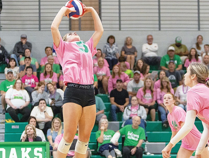 Libby Juergensmeyer of Blair Oaks sets the ball during Tuesday night’s match against Helias at Blair Oaks High School in Wardsville. (Josh Cobb/News Tribune)