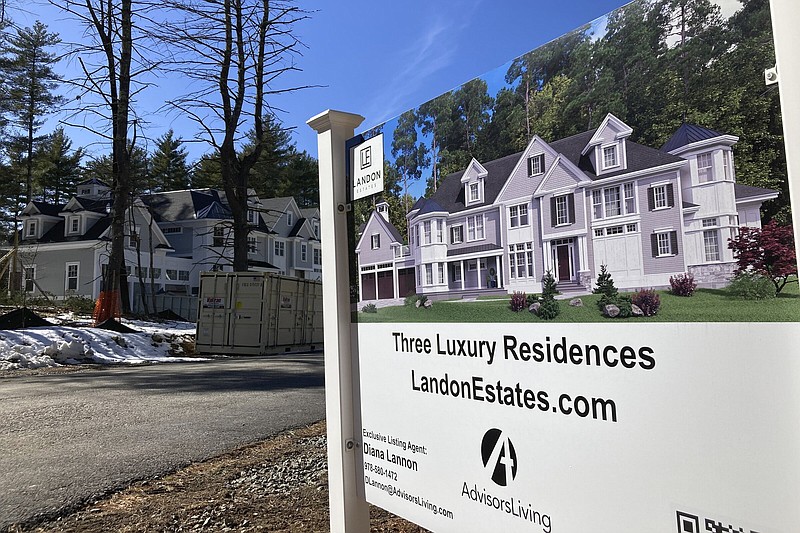 A sign announces newly built homes in Sudbury, Mass., in March.
(AP)