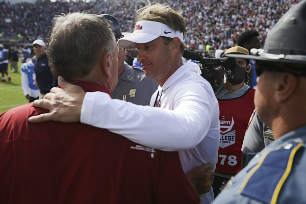 Ole Miss head coach Lane Kiffin meets Arkansas head coach Sam Pittman, Saturday, October 9, 2021 at the end of a football game at Vaught Hemingway Stadium in Oxford, Miss.
