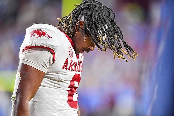 Arkansas tight end Ty Washington walks toward the sideline after the Razorbacks committed a turnover late in the fourth quarter of a 27-20 loss at Ole Miss on Saturday, Oct. 7, 2023, in Oxford, Miss. (NWA Democrat-Gazette/Hank Layton)