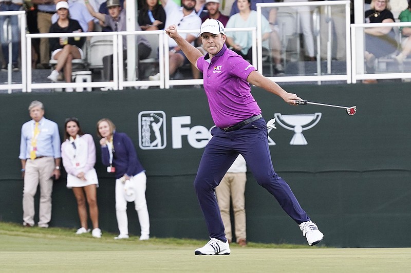 Luke List celebrates as he sinks a 40-plus foot putt for birdie on the first playoff hole Sunday to win the Sanderson Farms Championship in Jackson, Miss. (Associated Press)