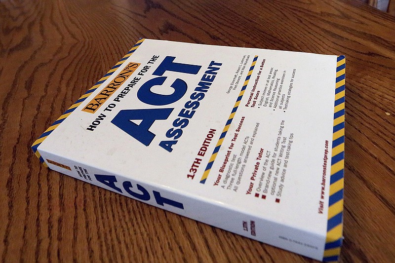 FILE - An ACT Assessment preparation book is seen, April 1, 2014, in Springfield, Ill. (AP/Seth Perlman, File)