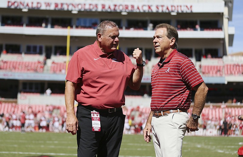 Arkansas Coach Sam Pittman chats with Alabama Coach Nick Saban on Oct. 1, 2022, before the start of a game at Reynolds Razorback Stadium in Fayetteville. The Razorbacks last won a game at Bryant-Denny Stadium on Sept. 27, 2003, when Saban was leading the LSU Tigers to a national championship and Pittman was the offensive line coach for the Northern Illinois Huskies, who had beat the Crimson Tide 19-16 a week earlier.
(NWA Democrat-Gazette/Charlie Kaijo)