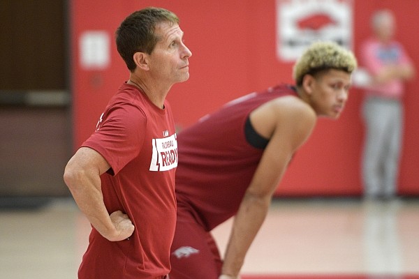 Arkansas coach Eric Musselman watches his team Thursday, Sept. 28, 2023, alongside forward Trevon Brazile during practice inside the Marsha and Marty Martin Family Basketball Performance Center on the university campus in Fayetteville.