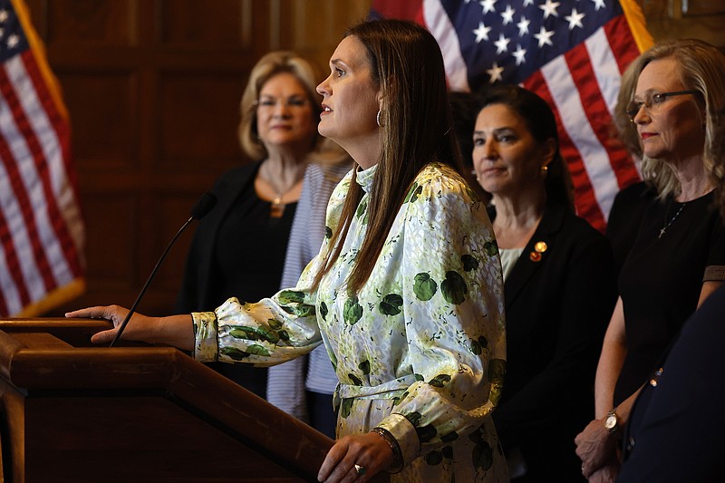 Gov. Sarah Huckabee Sanders announces an executive order “to Eliminate Woke, Anti-Women Words From State Government and Respect Women” during a press conference on Thursday, Oct. 19, 2023, at the state Capitol in Little Rock. (Arkansas Democrat-Gazette/TOMMY METTHE)