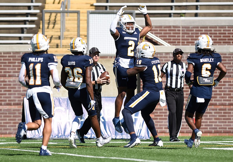 Staff photo by Matt Hamilton / UTC receiver Jamoi Mayes (2) celebrates with teammates after he scored a touchdown during Saturday's home win against ETSU. Mayes had 92 yards on five catches, including two touchdowns.