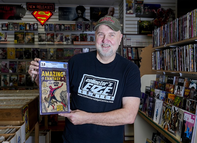 Steve Dobrzynski, owner of Collector's Edge Comics, holds an Amazing Fantasy #15 Marvel comic which is the first appearance of the Amazing Spider-Man on Wednesday, Oct. 18, 2023 in Milwaukee, Wis. (Jovanny Hernandez/ Milwaukee Journal-Sentinel via AP)