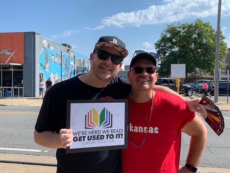 Greg Wagnon, founder of We're Here! We Read! Get Used To It! LGBTQIA+ Book Club, with book club member Tim Sisk is shown at Central Arkansas Pride Fest in October 2022 in North Little Rock. (Photo Courtesy of Greg Wagnon)