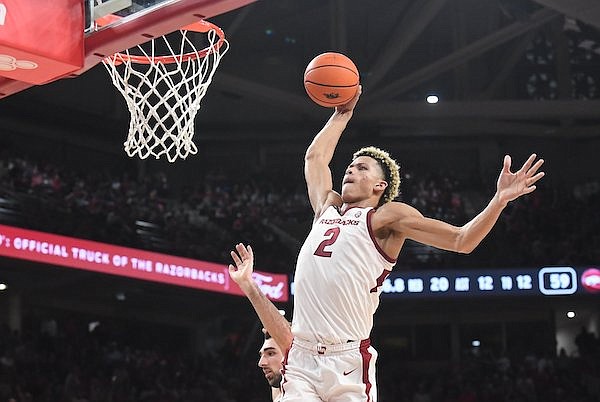 Arkansas center Trevon Brazile dunks the ball during a game against Purdue on Saturday, Oct. 28, 2023, in Fayetteville.