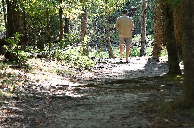 Staff photo by Matt Hamilton/ A park guest uses a hiking trail at Harrison Bay State Park on Friday, September 29, 2023.
