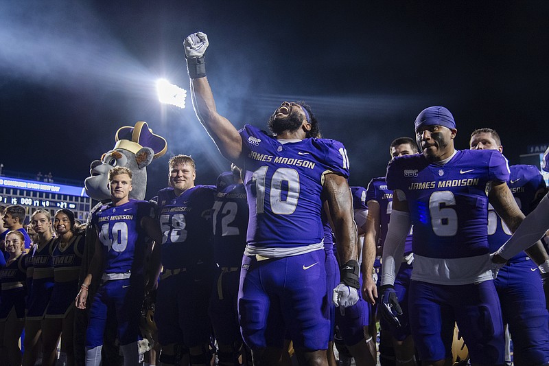James Madison defensive lineman Jalen Green (10) celebrates after the team's NCAA college football game against Old Dominion on Saturday, Oct. 28, 2023, in Harrisonburg, Va. (AP Photo/Mike Caudill)