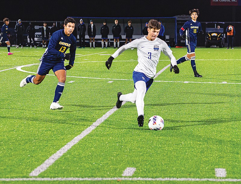Weston Schofield advances the ball for Capital City during Wednesday night’s Class 3 District 5 Tournament championship match against Springfield Catholic at Capital City High School. (Ken Barnes/News Tribune)