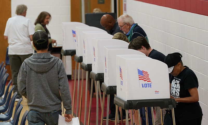 Voters make their choices at a polling station Tuesday Nov. 7, 2023, in Richmond, Va. (AP Photo/Steve Helber)