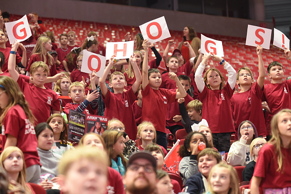 Students hold up signs from Friday, November 8, 2019 before the University of Arkansas Razorback and University of New Orleans women's basketball game at Bud Walton Arena on the campus in Fayettville.
