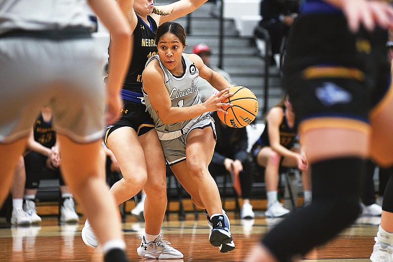 Lincoln’s Saniya Simmons drives to the basket during a game last season  against Nebraska-Kearney at Jason Gym. (News Tribune file photo)