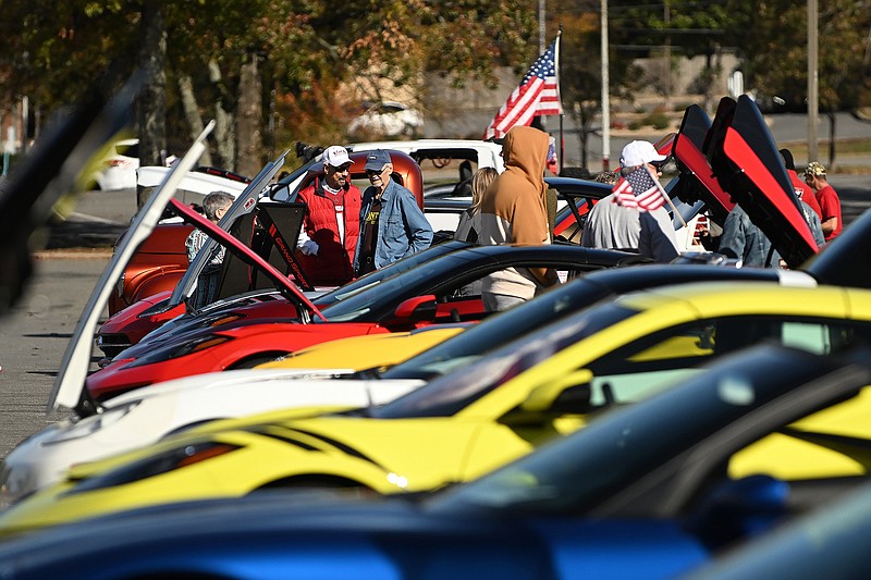 People check out the dozens of Corvettes on display Saturday during the “Corvettes and Veterans” event at War Memorial Stadium in Little Rock.
(Arkansas Democrat-Gazette/Staci Vandagriff)