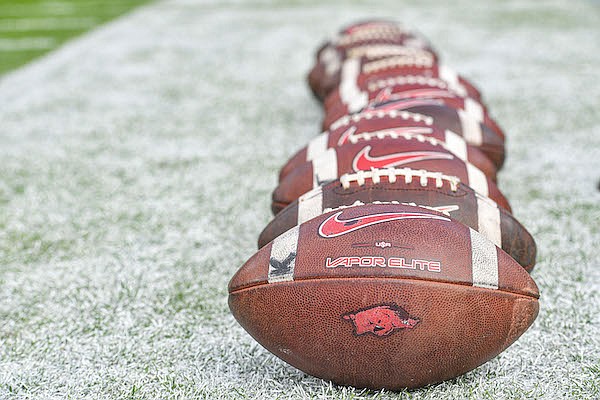 Arkansas footballs are lined up prior to a game against Florida on Saturday, Nov. 4, 2023, in Gainesville, Fla.